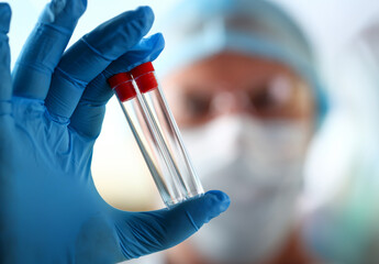 Male scientist hold in arm empty vials closeup. Chemical lab exam food additives medical blend...
