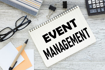 Event management Concept. top view on open notebook glasses. word