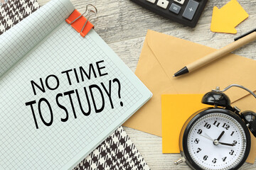 no time to study table clock and notepad. text on the page against the background of the envelope