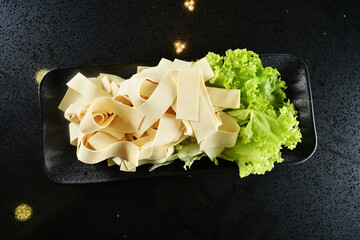 cold mixed raw vegetables,  beancurd, mushroom, carrot, noodle, tofu, lotus, corn in plate for...