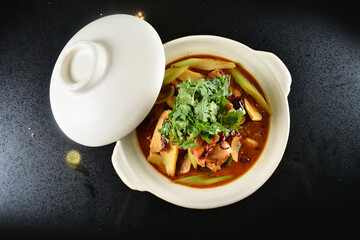 spicy mala laksa curry hot clay pot with seafood prawn, scallop, chicken meat, vegetable, noodle...