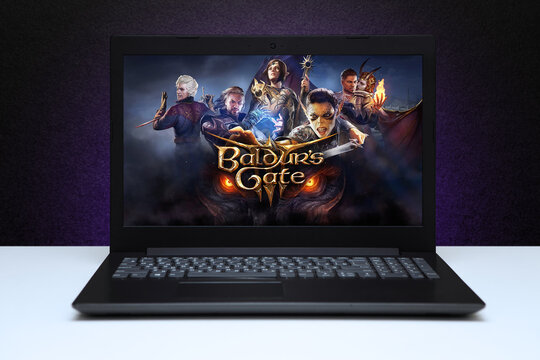 Baldurs Gate 3 game on the screen laptop computer on black textured wall with purple light. Astana, Kazakhstan - August 3, 2023.