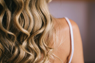 Blonde hair with balayage technique. Concept of hairdressing and aesthetics