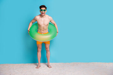 Full body photo of handsome young guy inflatable ring excited have swim dressed stylish yellow...