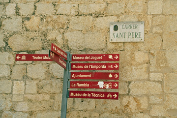Landscape of signs outside of Theater Museum of Salvador Dali in Figueres Catalonia