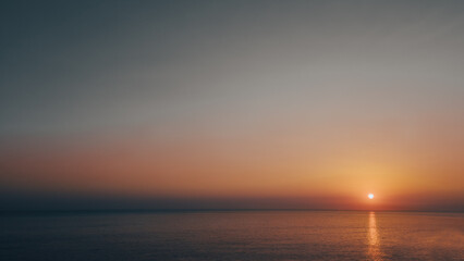 Negative space at sunset. Sea, sun in cinematic style