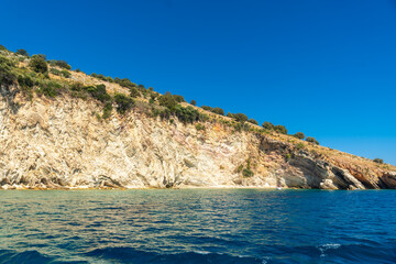 Fototapeta na wymiar Beautiful Gremina beach seen from the boat on the Albanian riviera near Sarande, turquoise sea water