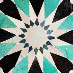 Sixteen-pointed star. Alicatados mosaic. Arab tiles in Cordoba, Andalusia, Spain. 