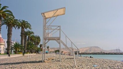Beach guard tower minimal with a Rescue. A wooden observation post at the beach.