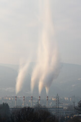 Smoke coming out of chimneys of heating plant at winter morning, Borik settlement in Banja Luka, Bosnia and Herzegovina
