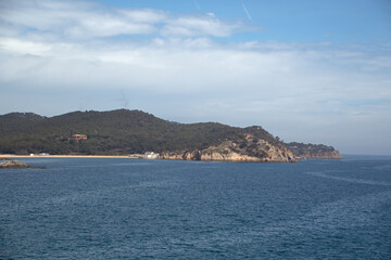 Seascape view of beach and village of Cadaques during summer on Costa Brava Catalonia