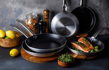 pots and pans in the kitchen, on a gray background