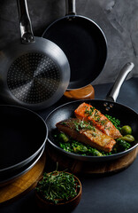 pots and pans in the kitchen, on a gray background