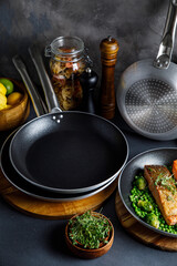 pots and pans in the kitchen, on a gray background