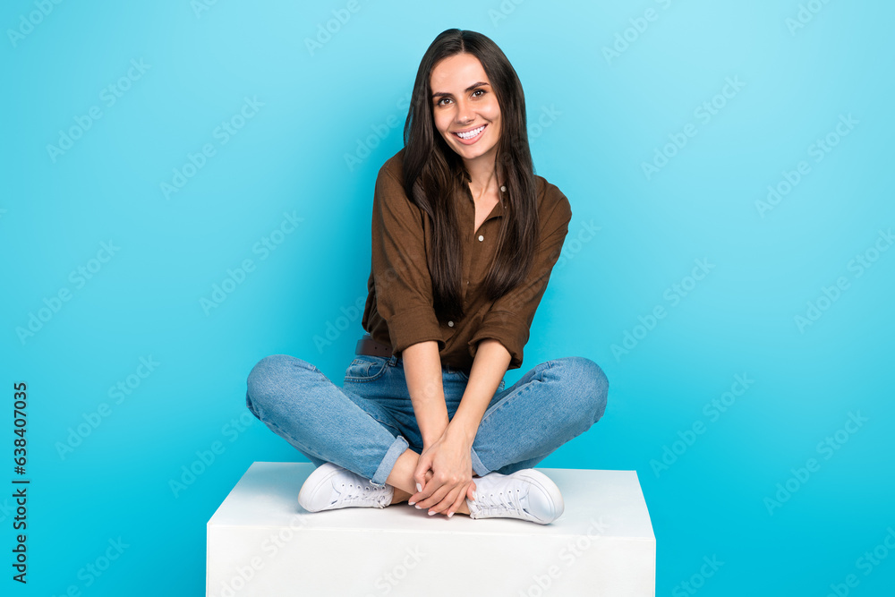 Poster full length cadre of dreamy cute lovely young woman wear brown shirt sitting box crossed legs comfor