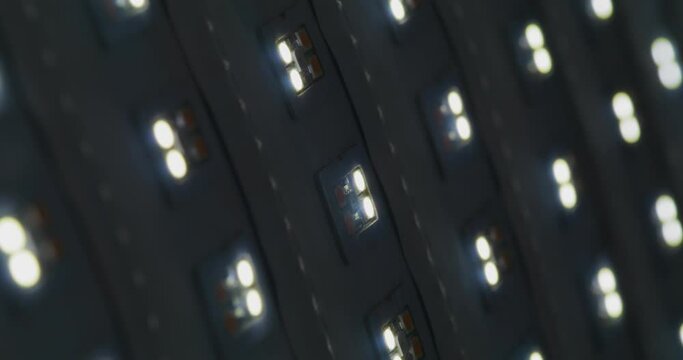 Macro shot of multicolored RGB diode blinking lights. LED colored dots led light panel with different effects.