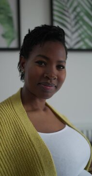 Portrait of pregnant woman at home