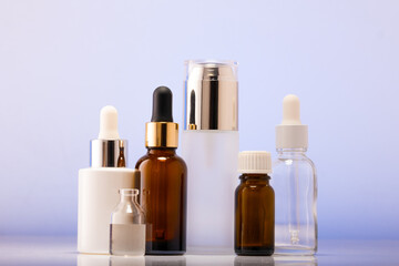 A lot of cosmetic bottles on a white table, an assortment of cosmetic bottles in the bathroom, healthy cosmetology, spa concept