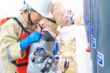 marine biologists inspect plankton on research ship