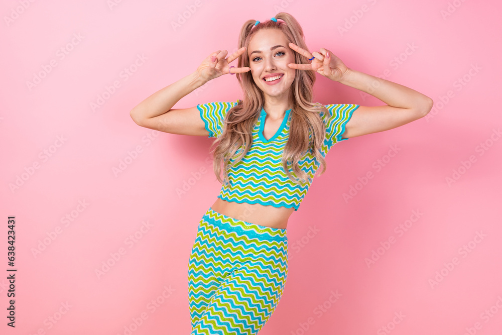 Sticker Photo of crazy cheerful girl wear stylish outfit hand showing v-sign enjoy summer vacation party isolated on pink color background