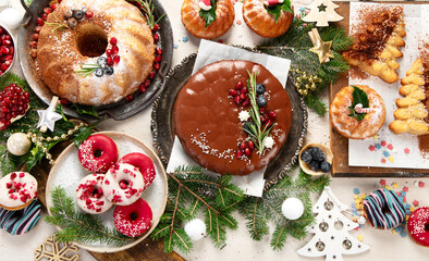 Variety of Christmas holiday desserts and sweets. Christmas decoration.