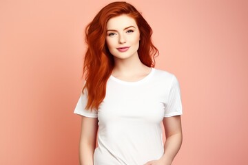 Obraz premium red head wearing white tshirt on plain background for mock up or presentation