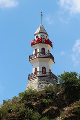 Fototapeta na wymiar Göynük Clock Tower is situated high on a hill. The Clock Tower was built in 1923 during the Republican era. Wood was used in the construction of the tower.