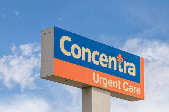 Concentra Urgent Care pole sign with the blue sky in the background. Sparks, Nevada, USA, June 5, 2023. Concentra Inc. is an  American health care establishment. 