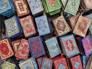 cosmetic bags or wallets with oriental patterns, souvenirs in turkish shop. Full frame travel background