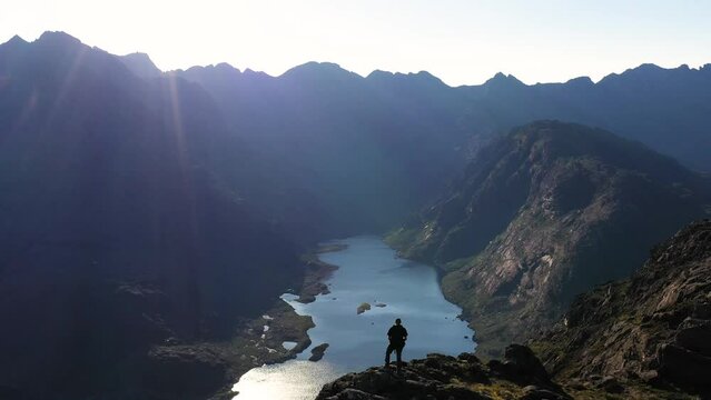 Aerial view of the Jagged Mountains, Lochs and Sea on the Isle of Skye, Scotland UK on a Sunny Day. Hiking and camping in the Cuillin Mountains. 