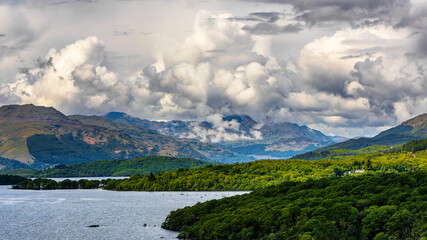 Beautiful Scottish Loch (Lake) with islands surrounded by mountains and a dramatic sky (Loch Lomond)