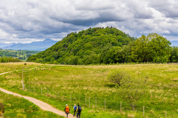 Hikers on the West Highland Way in dramatic rural scenery near Loch Lomond, Scotland