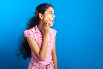 An Indian girl suffering from toothache