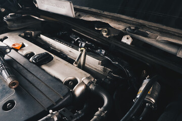 Mechanic man hand repair ignition on car engine