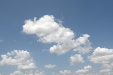 Fototapeta premium Fluffy white clouds on a blue sky.