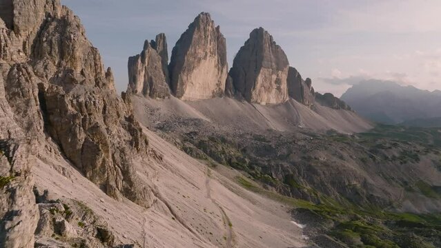 Aerial view of the Three Peaks of Lavaredo or Tre cime di Lavaredo in evening. Scenic symbol of the Dolomites, Italy. 