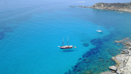 Aerial of yacht on blue water, sailing in Croatia and summer sun on ocean holiday, relax in freedom and nature seascape. Boat vacation, travel and tropical cruise on sea adventure to island coast.