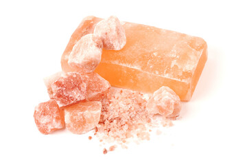 Chipped Himalayan salt stone, crystals and crushed blocks of natural pink salt isolated on white background