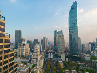 Aerial view city office building with BTS urban train transport sunset sky Silom district