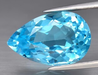 Natural gemstone blue topaz on a gray background