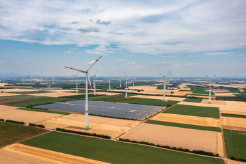 Bird's-eye view of solar panels in the middle of a wind farm in Rhineland-Palatinate/Germany