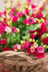 Closeup of a basket full of purple lisianthus flowers