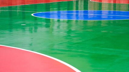 Colorful outdoors futsal court background with light reflection on surface in wide screen view