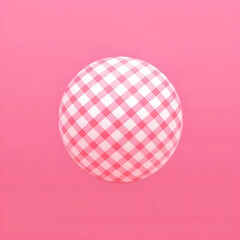 A ball with a checkered pink pattern against a pink background, retro nostalgia