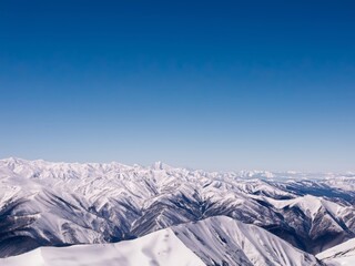 Fototapeta na wymiar Breathtaking view of a snowy mountain range