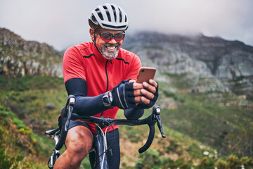 Happy man, cyclist and phone on mountain bicycle in communication, social media or networking in...