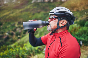 Man, cyclist and drinking water on mountain in fitness, diet or natural nutrition in rest or break...