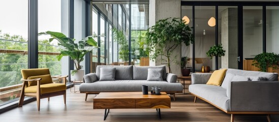 Fototapeta premium Modern apartment living room with potted plants near window featuring cozy sofas and a wooden table