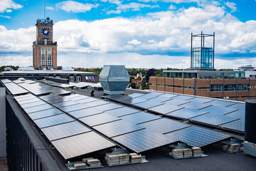 Installation of solar panels on a flat roof, in the center of Copenhagen. © Road Red Runner