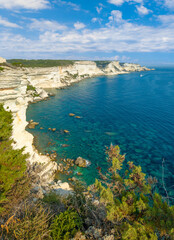 Fototapeta na wymiar Bonifacio (Corse, France) - Corsica is a big french island in Mediterranean, beside Italy. Here the town of Bonifacio with plages Fazzio, Saint Antoine, Santa Giulia; phare Pertusatu and Madonenetta